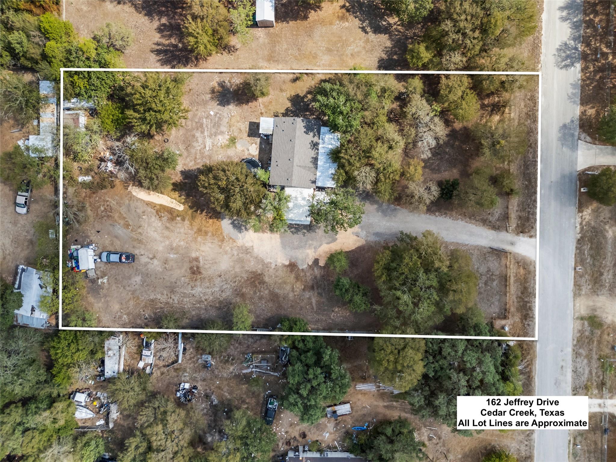 Mature trees surround this expansive property wit