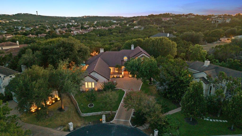Lush landscaping and rolling hillside vistas fram