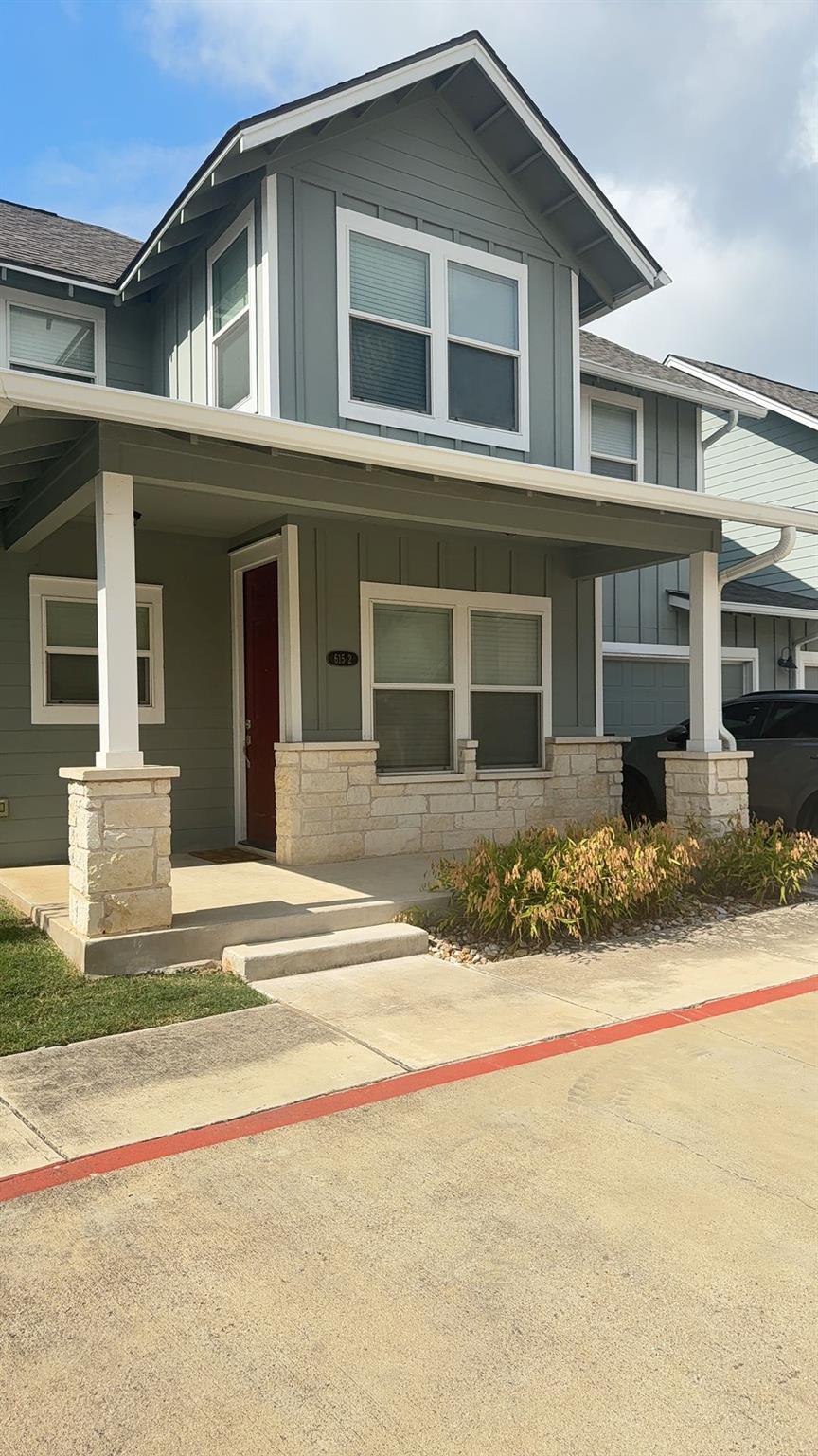 Welcoming front porch entry showcases charming st