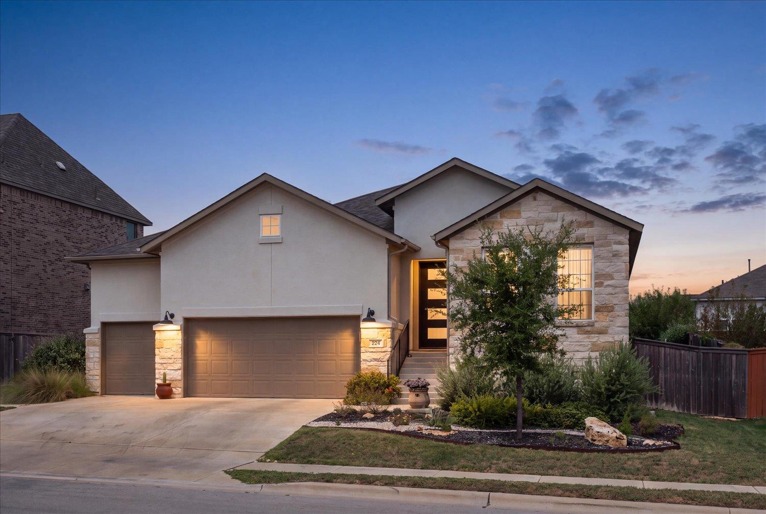 Stone and stucco accents define this classic exte