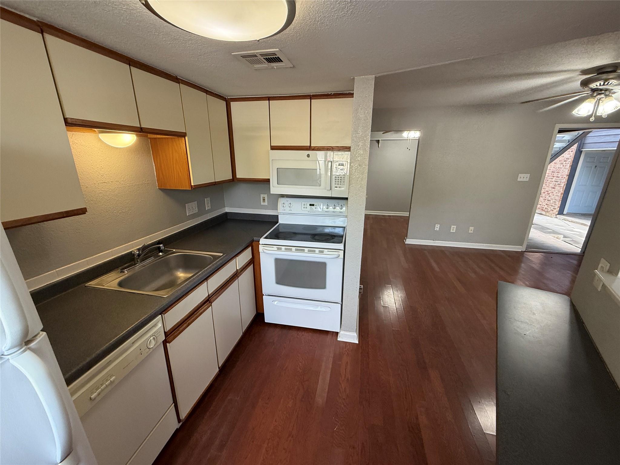 Gleaming wood floors anchor this open-concept lay