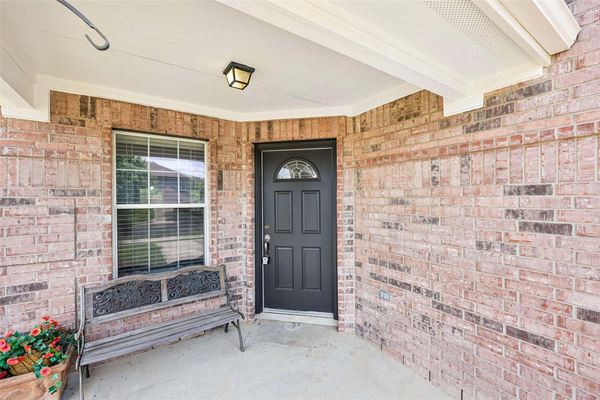 An inviting front entry welcomes visitors with so