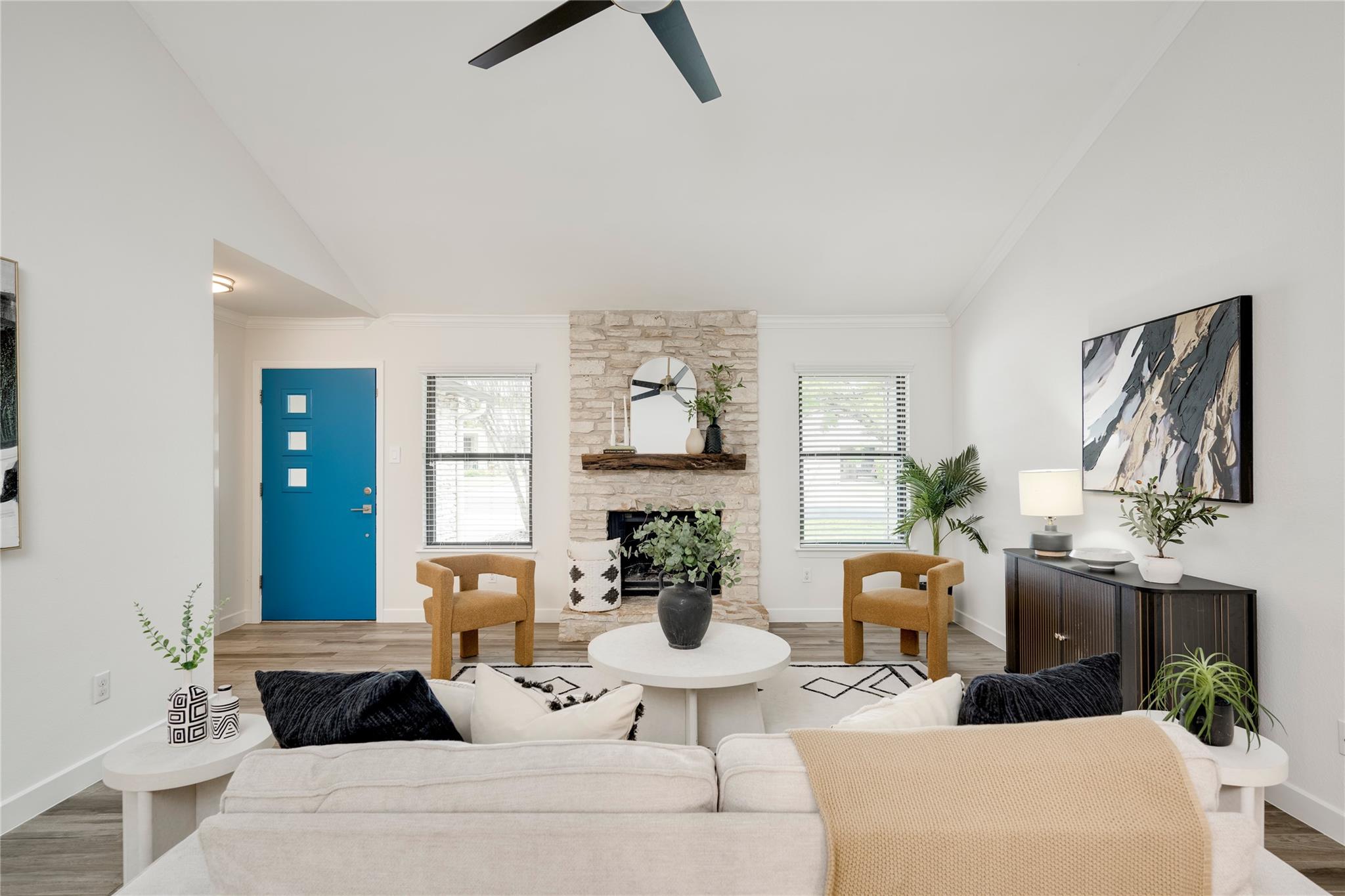 Spacious living area featuring vaulted ceilings, 