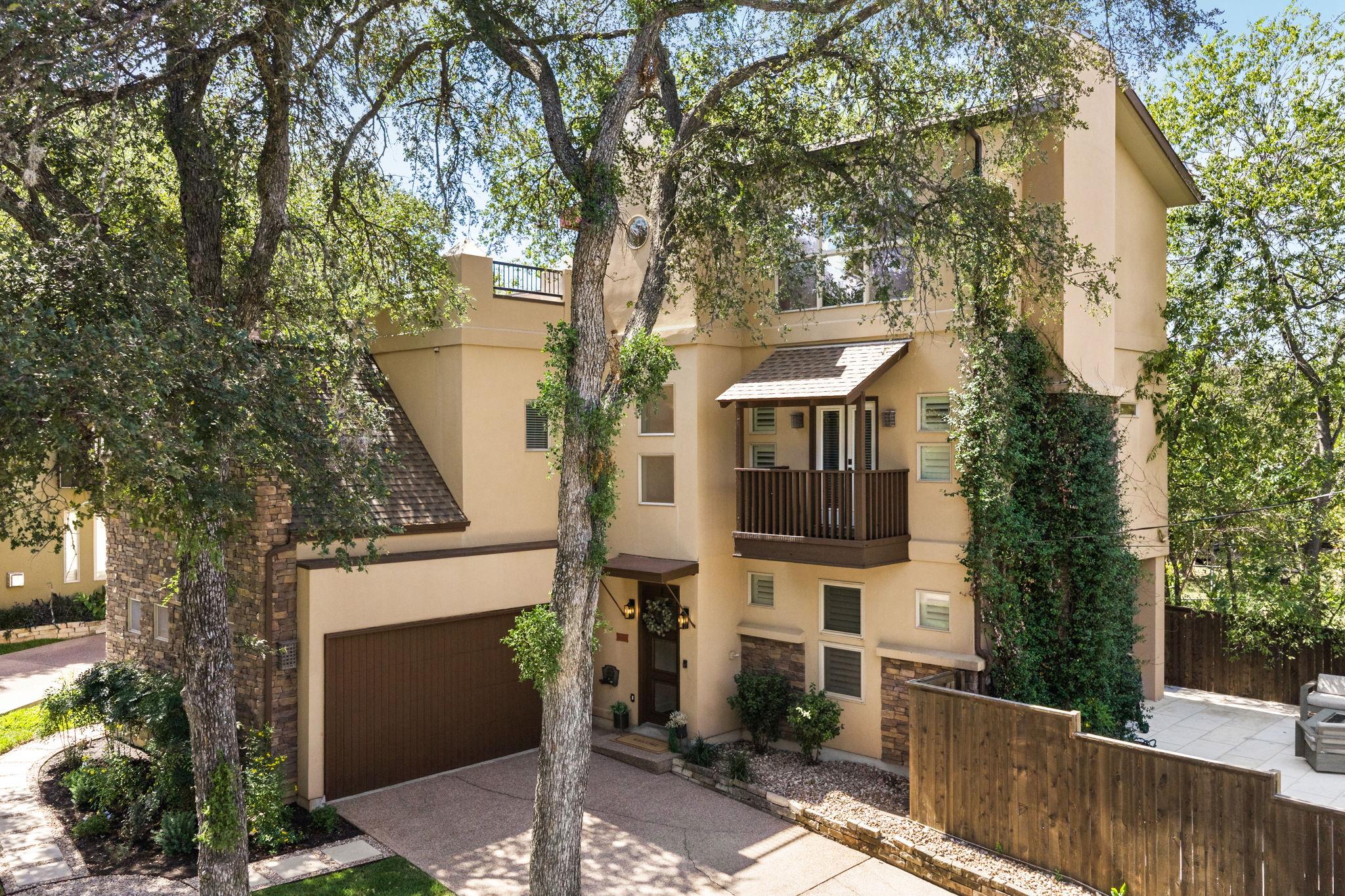 Mature trees shade a contemporary multi-level ext