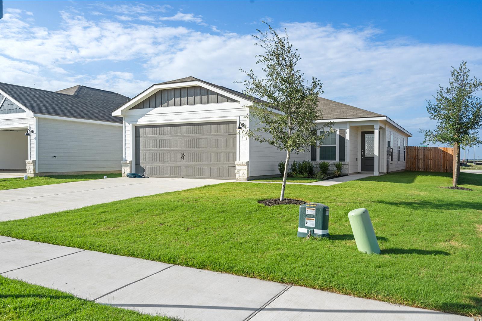 Contemporary single-story home featuring a two-ca