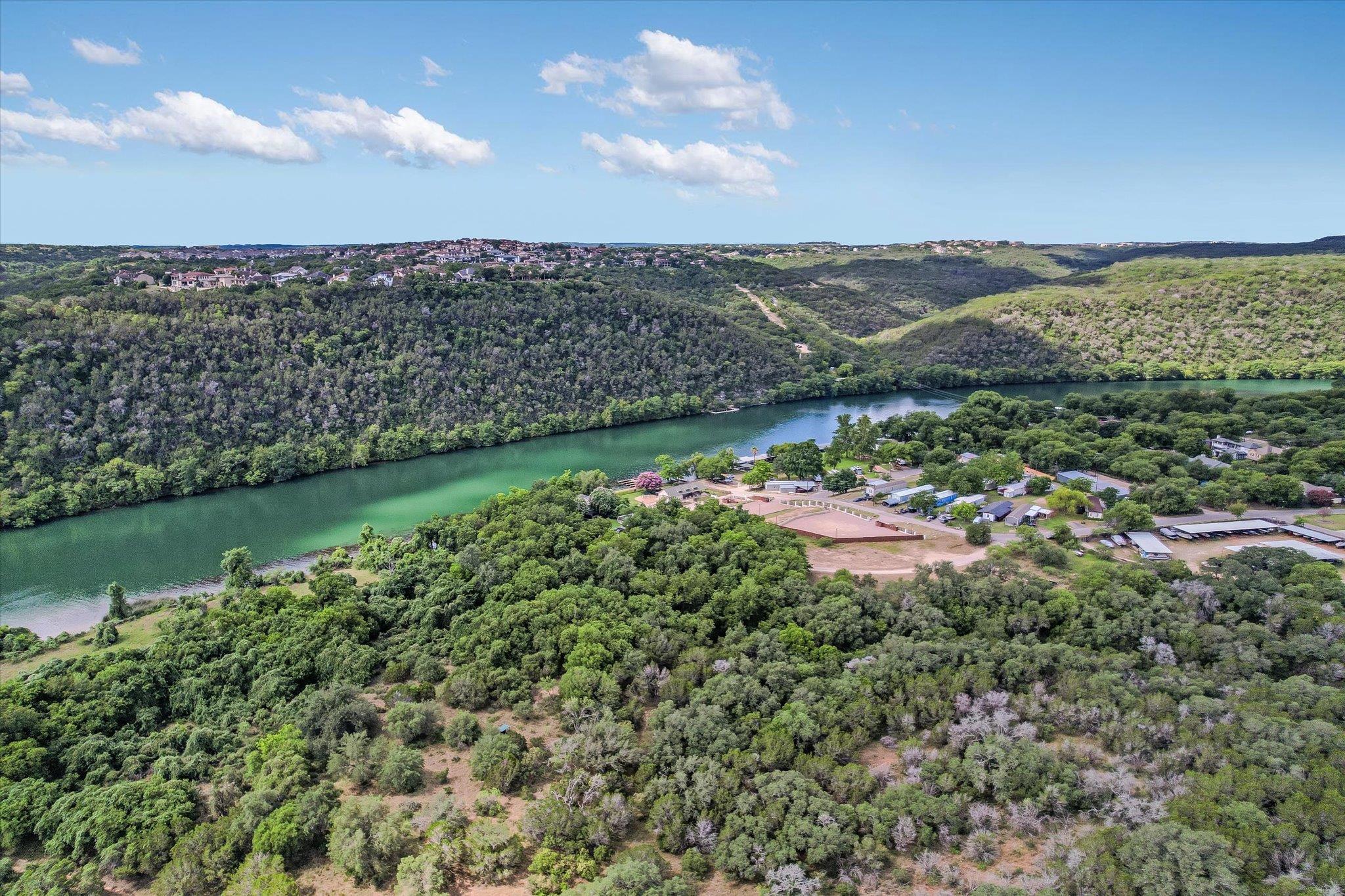 Lush rolling hills frame a winding river valley u