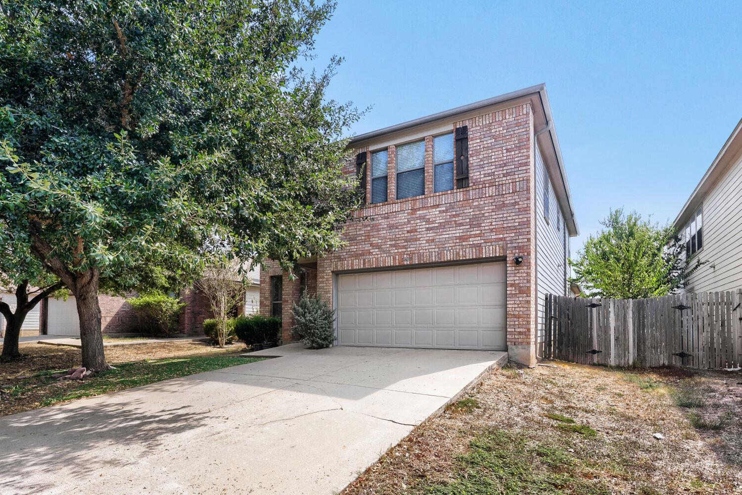 A classic brick exterior paired with a concrete d