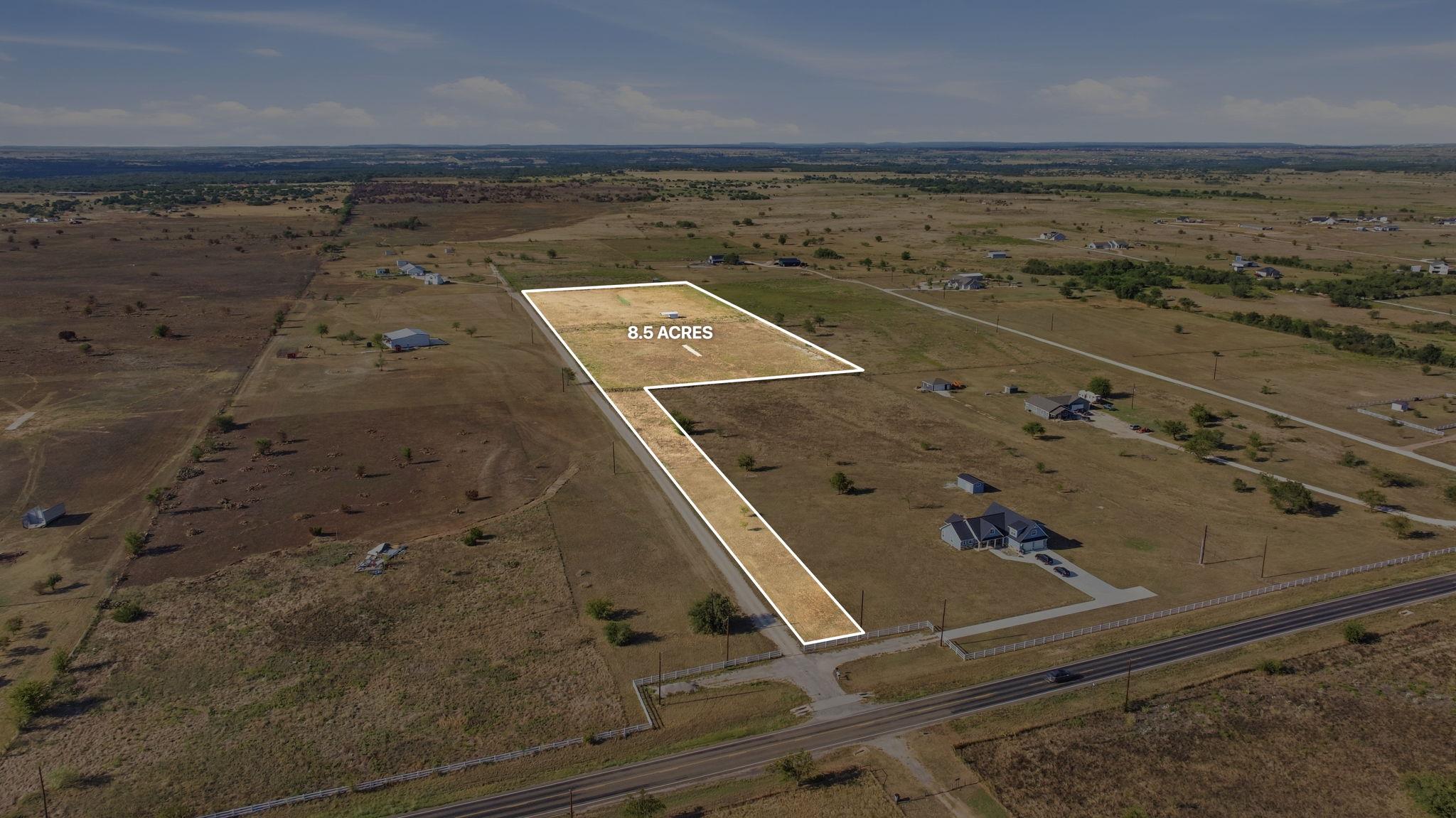 A spacious, open acreage parcel with natural gras