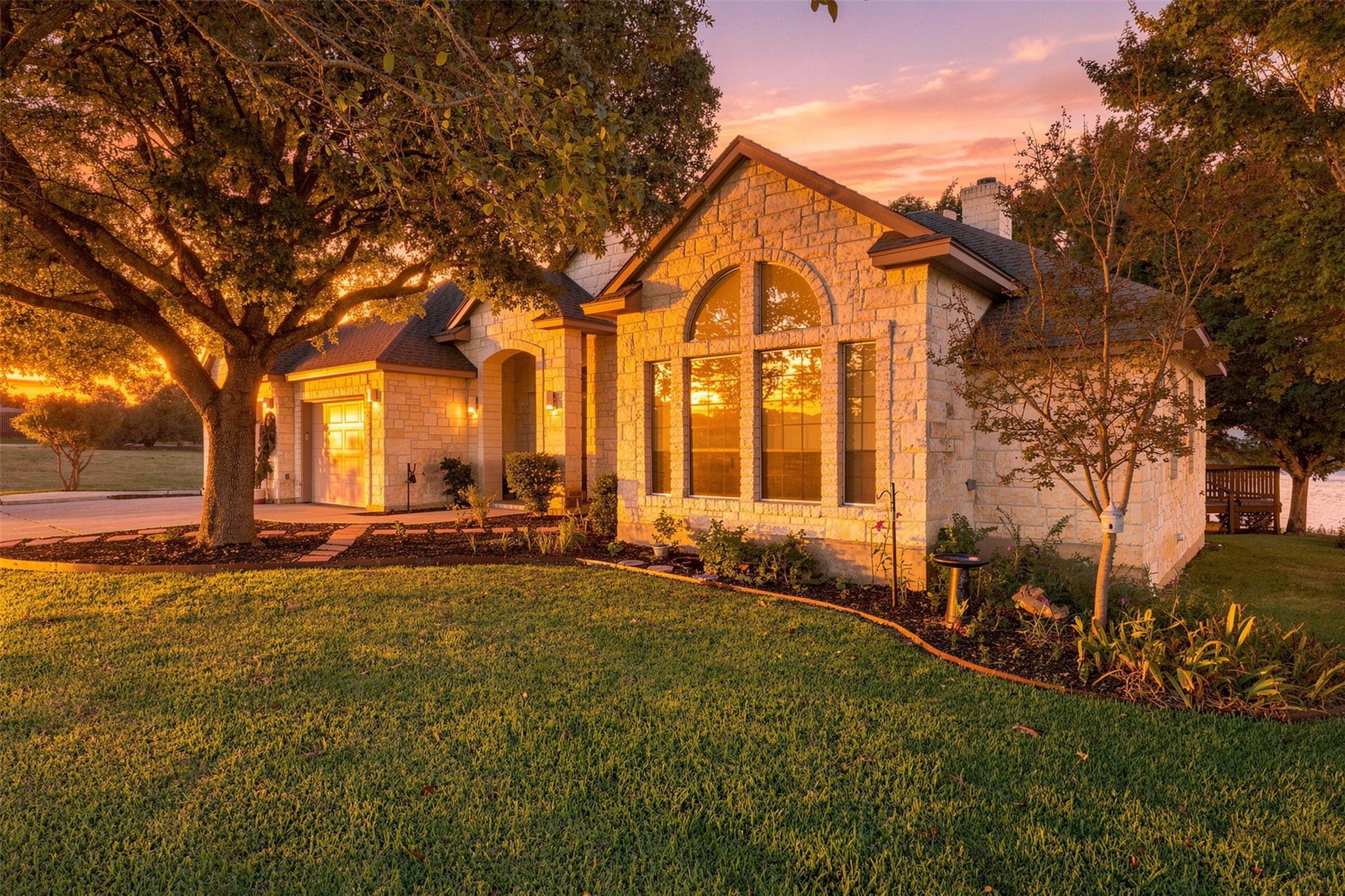 Stately stone masonry and arched windows define t