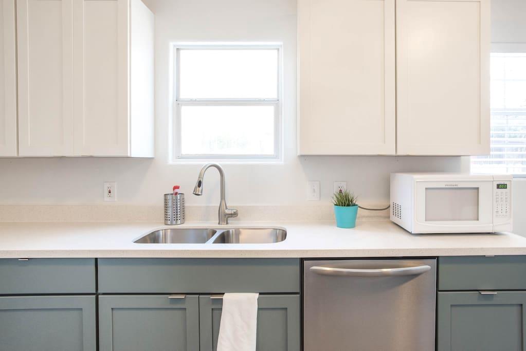 Crisp white upper cabinetry pairs perfectly with 