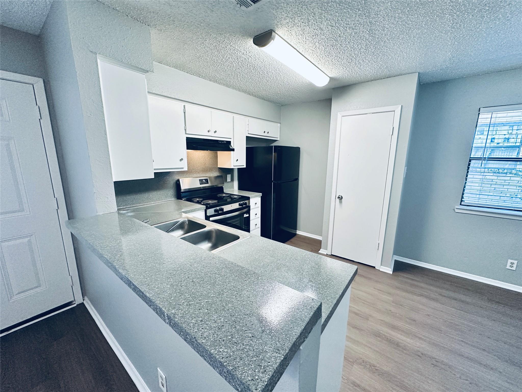 An open kitchen layout transitions smoothly into 