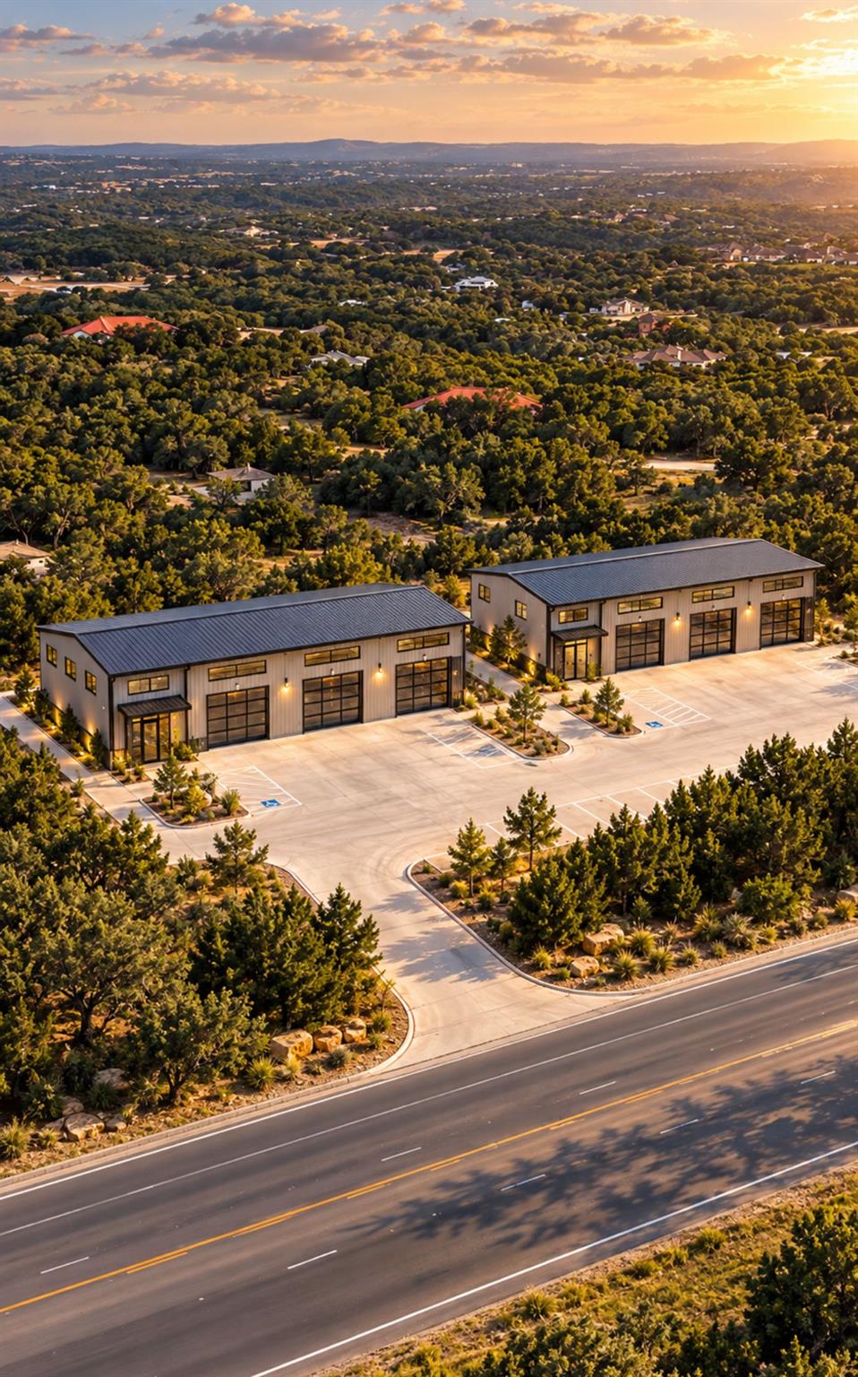 Ample concrete parking surrounds modern structure