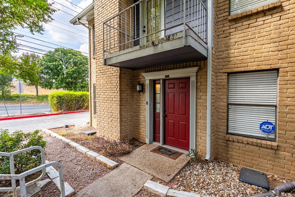 A classic brick exterior framing the welcoming gr