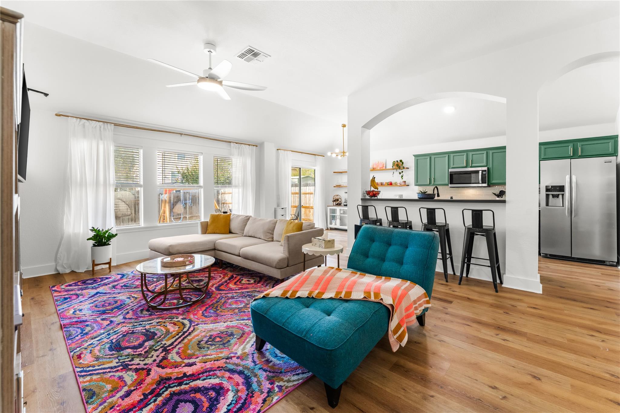 An open floor plan connects the living space to t
