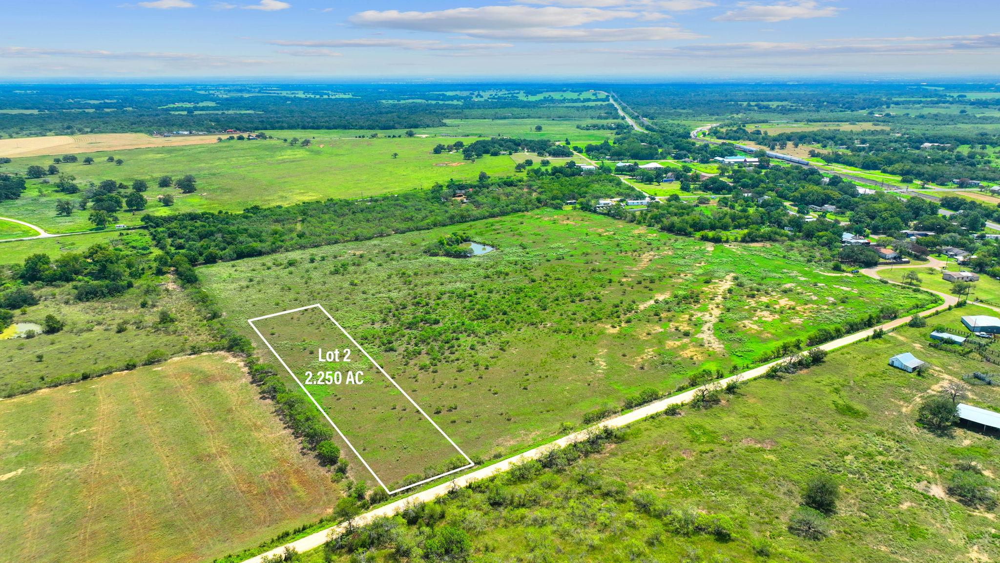 An aerial perspective showcases a vast acreage pa
