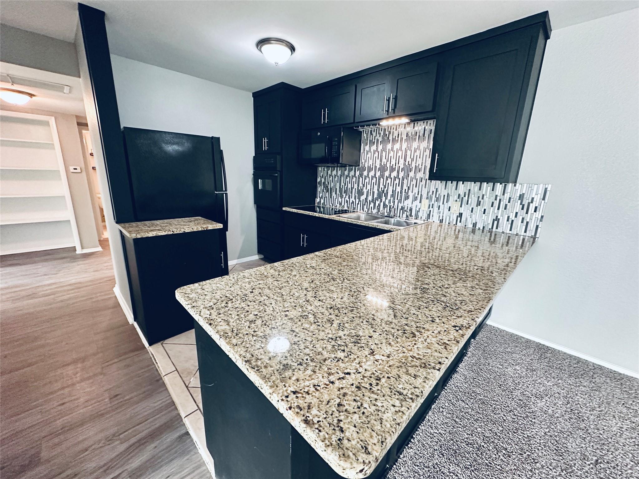 Polished stone counters elevate this contemporary