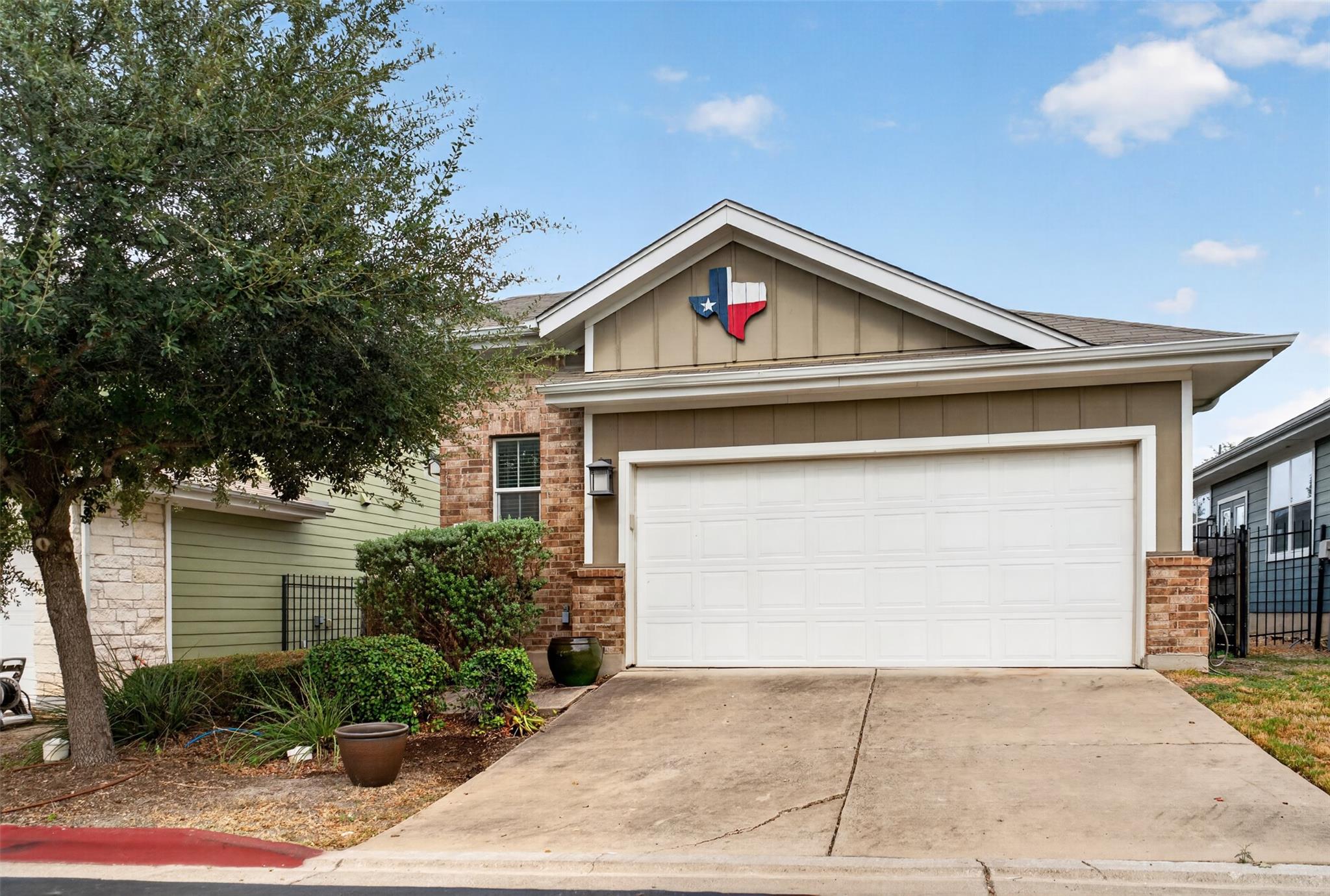 Clean lines and a spacious driveway define this m