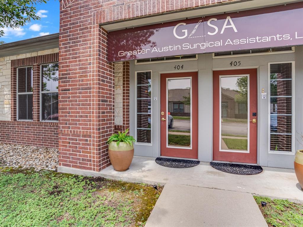 A neat brick exterior frames the private entry do