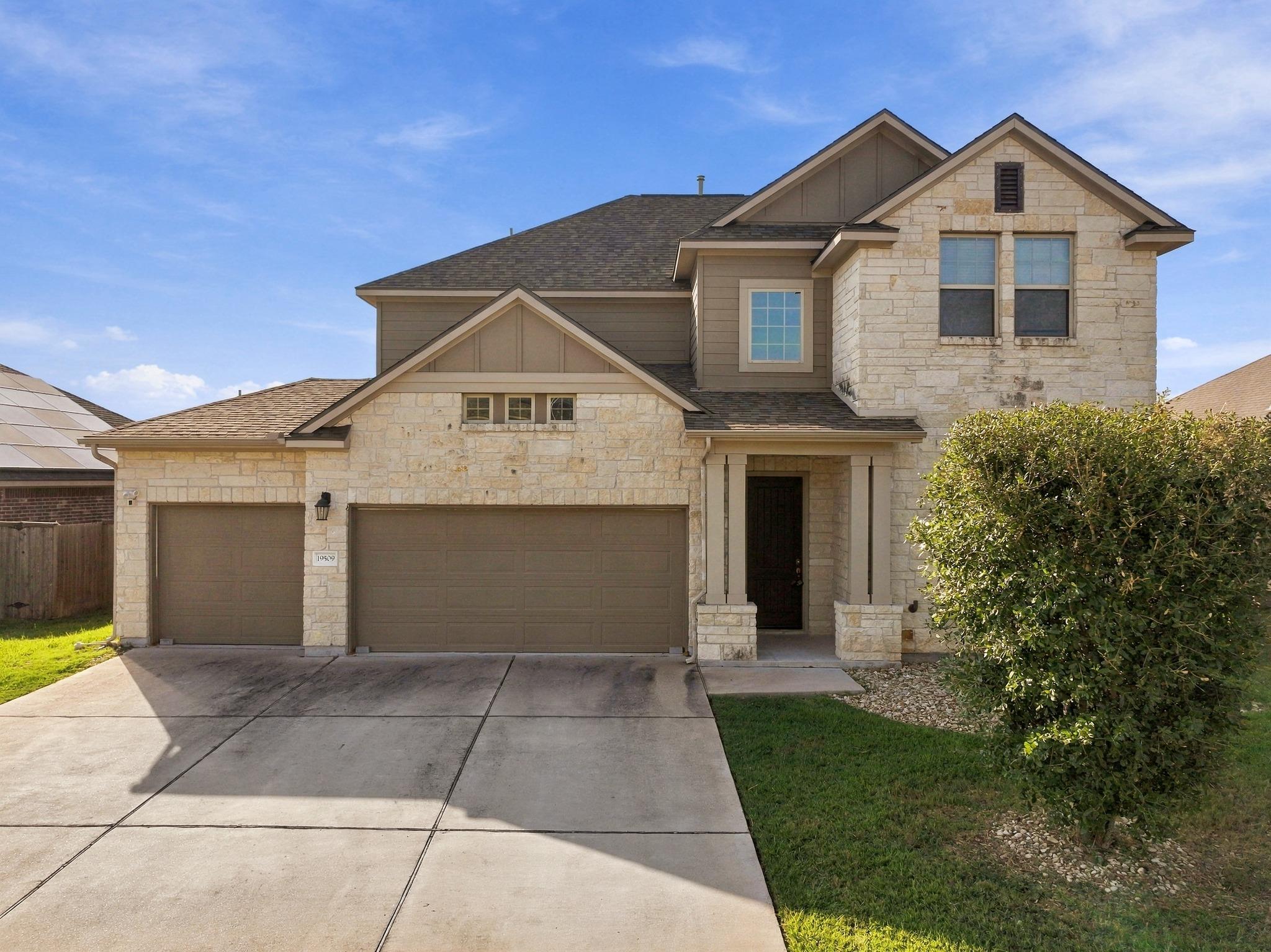 Natural stone masonry and a spacious concrete dri