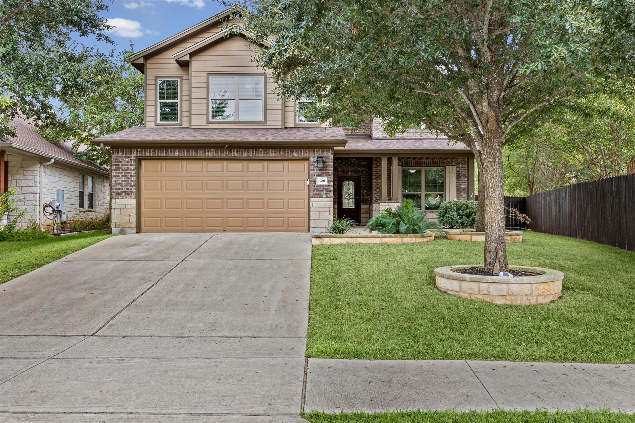 A classic two-story exterior features brick and s