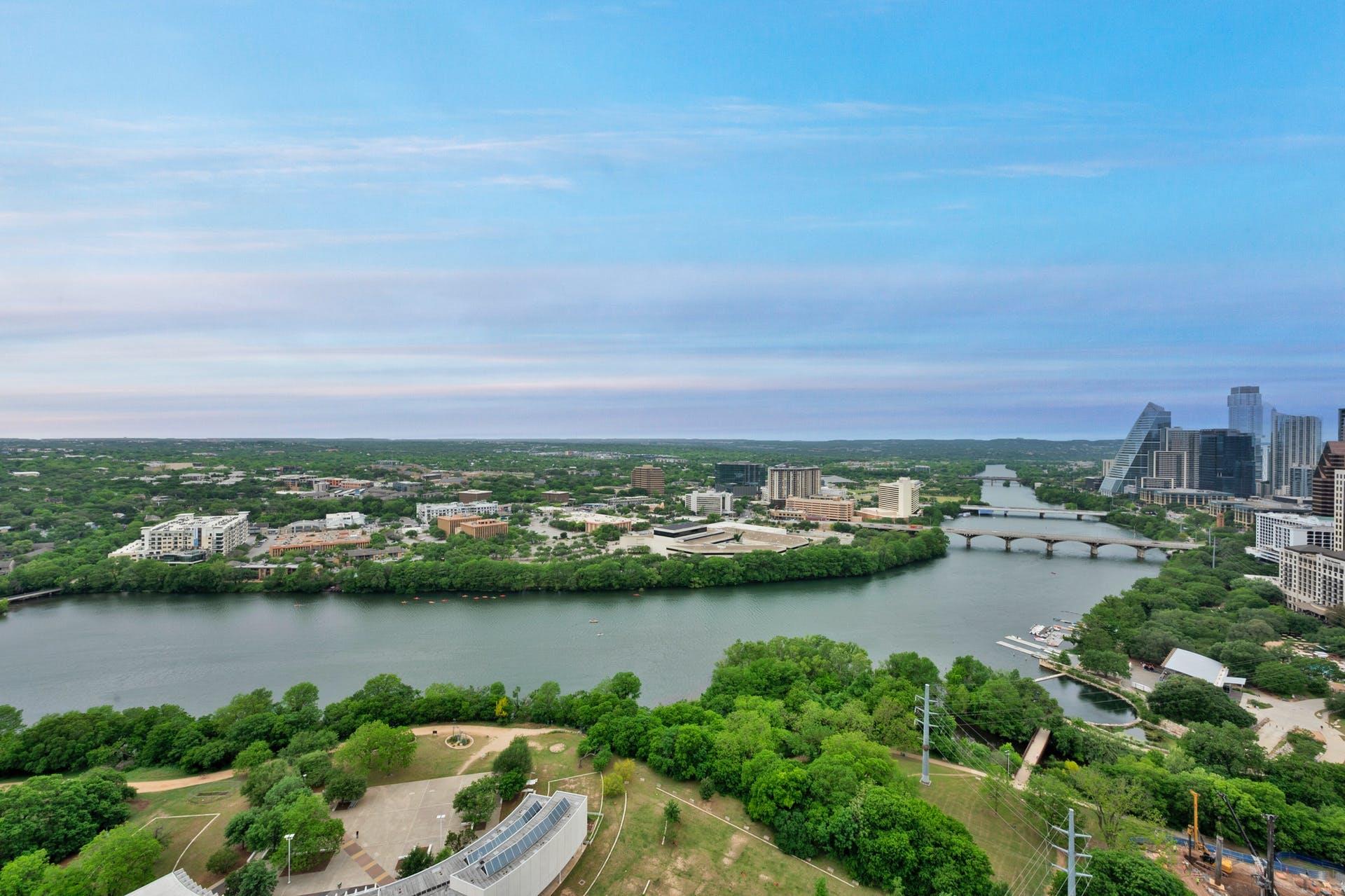 Panoramas of the river and city skyline stretch a