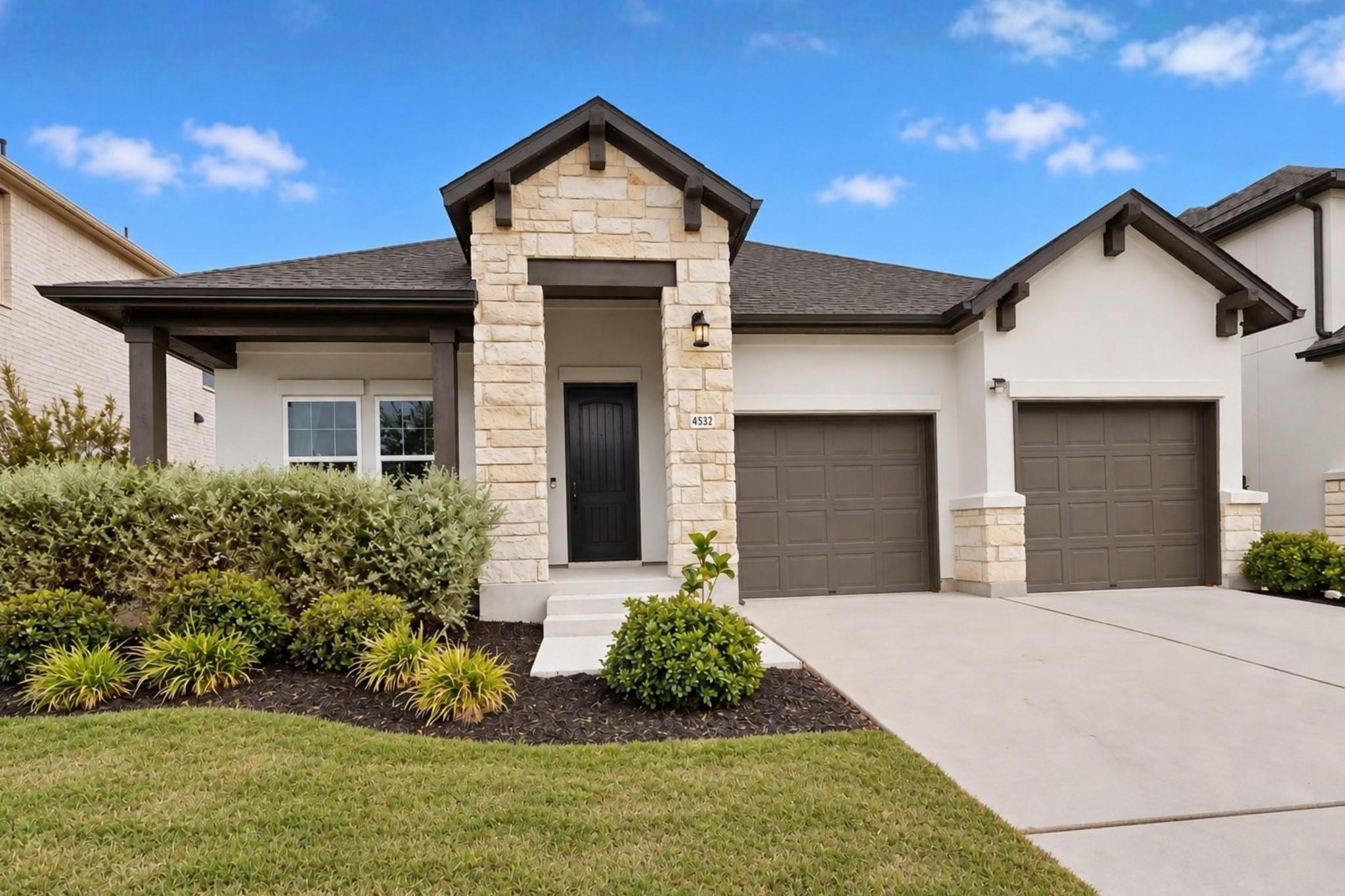 Clean architectural lines pair with stone masonry