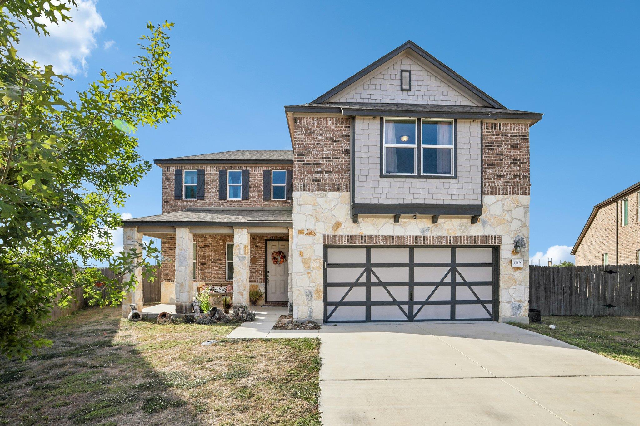 An inviting exterior balances classic brick mason