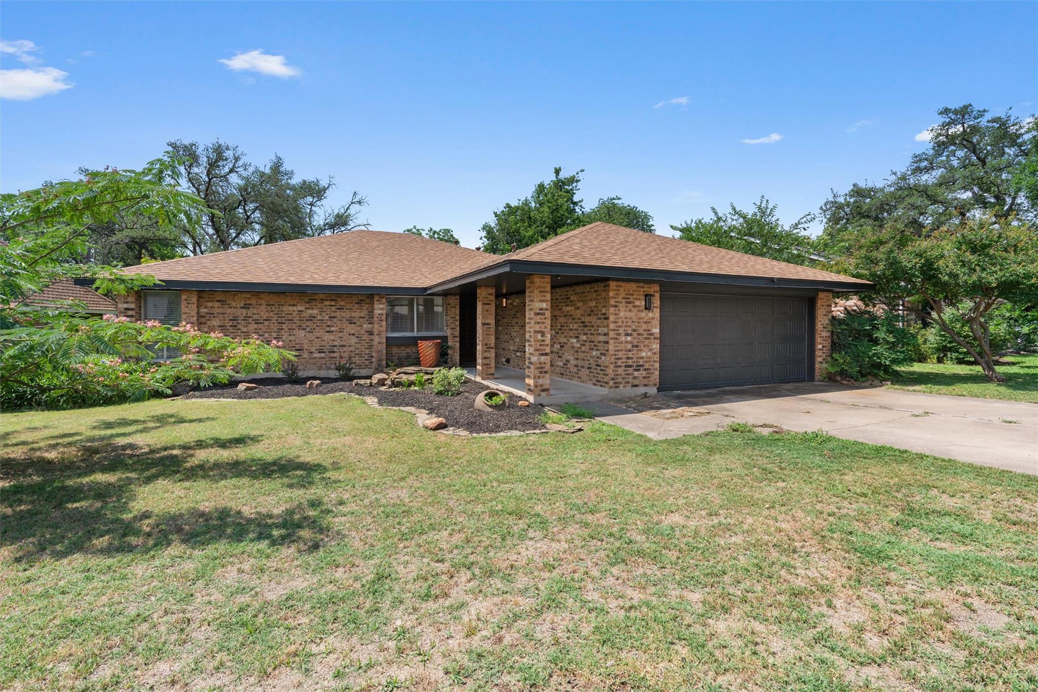 Classic brick exterior details and a spacious law