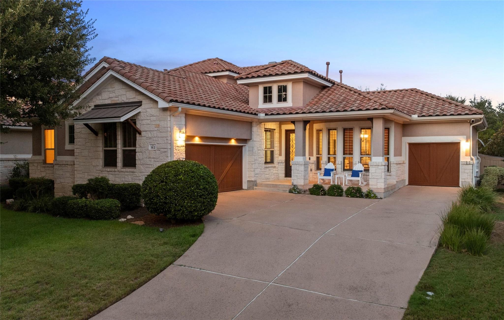 Elegant stone exterior surfaces and a clay tile r