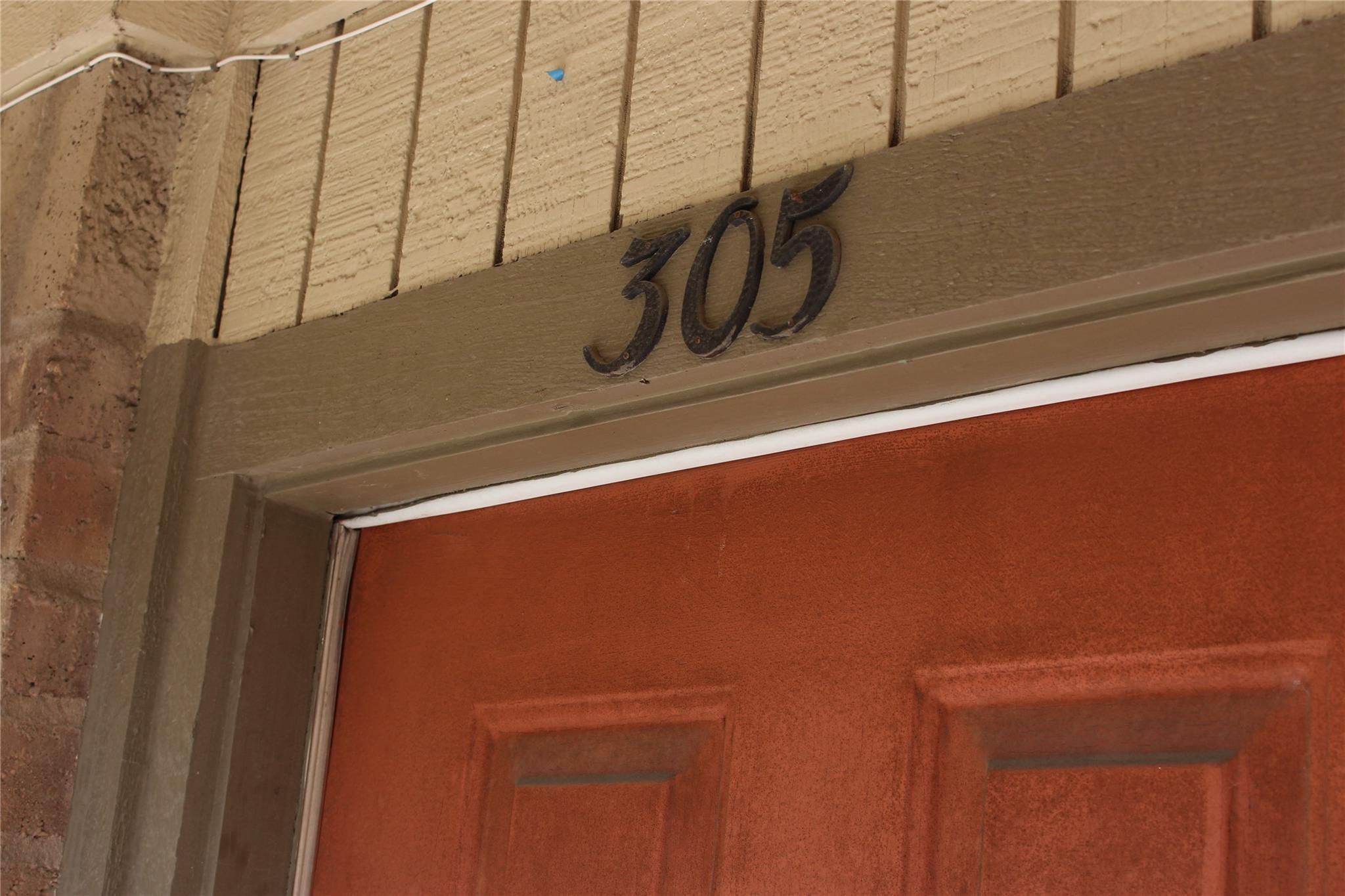 An inviting entrance displays a classic paneled e