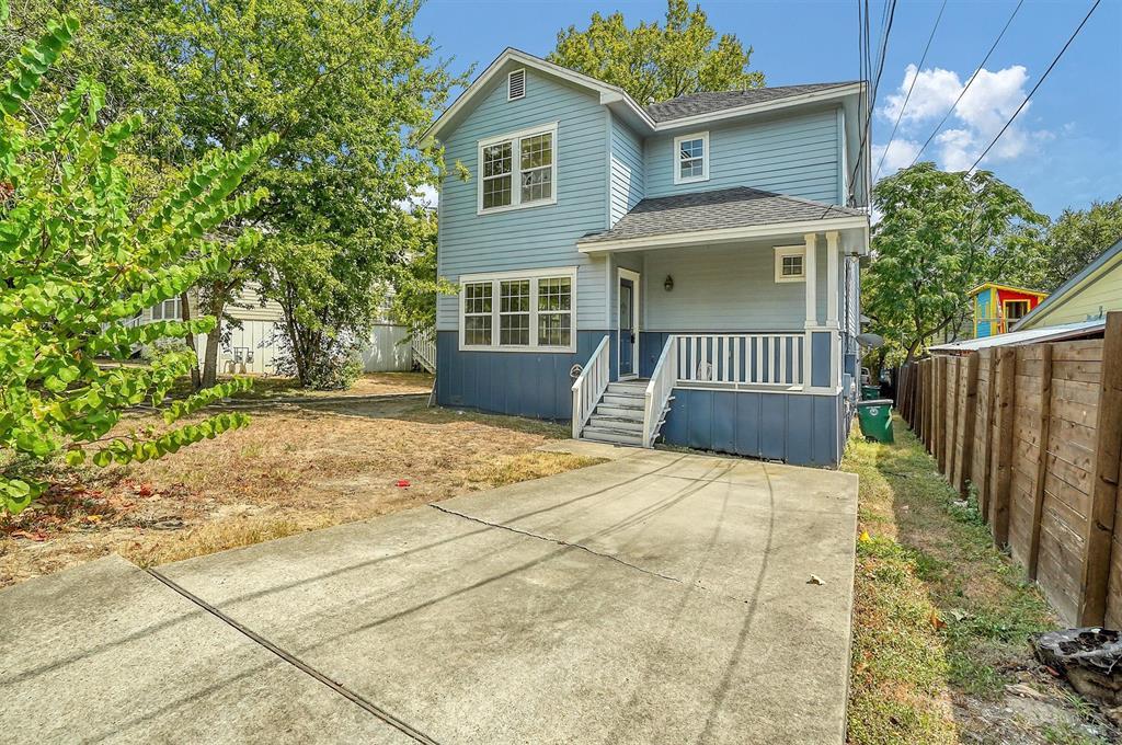 Classic siding exterior and a concrete driveway l