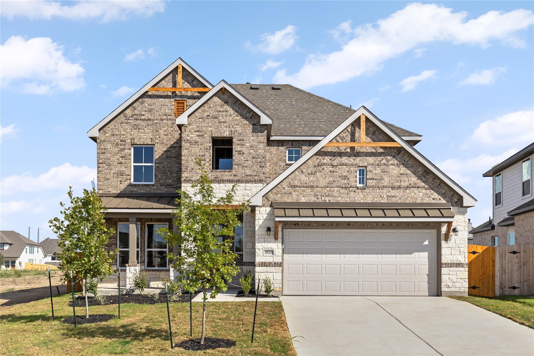 Textured brickwork and stone accents define this 