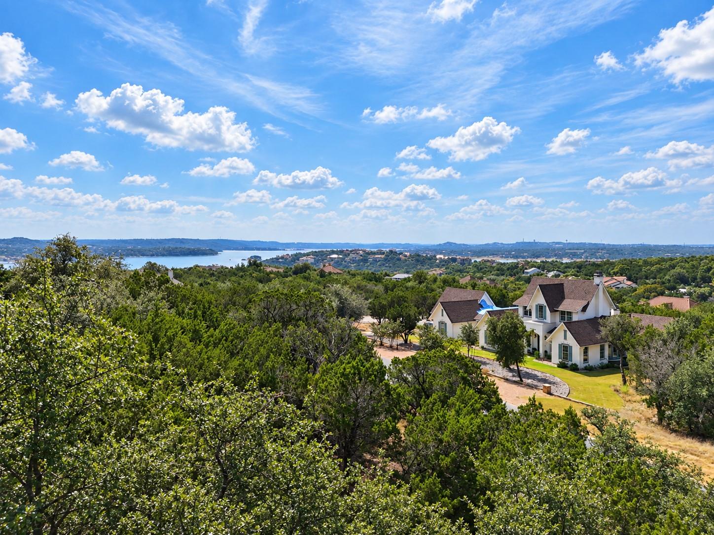 Rolling hills and distant water views frame this 