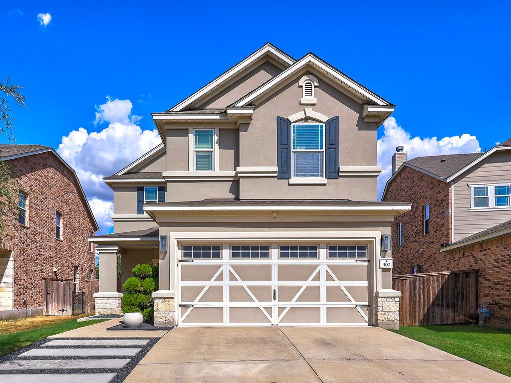 An inviting exterior displays timeless stucco and