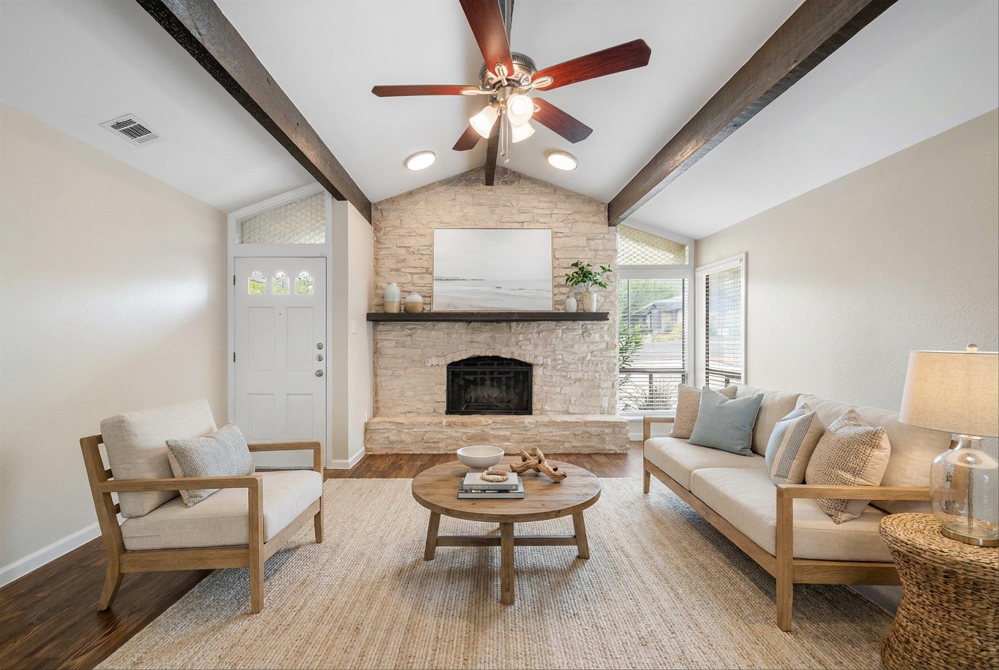 Rich wood beams flank a soaring vaulted ceiling a