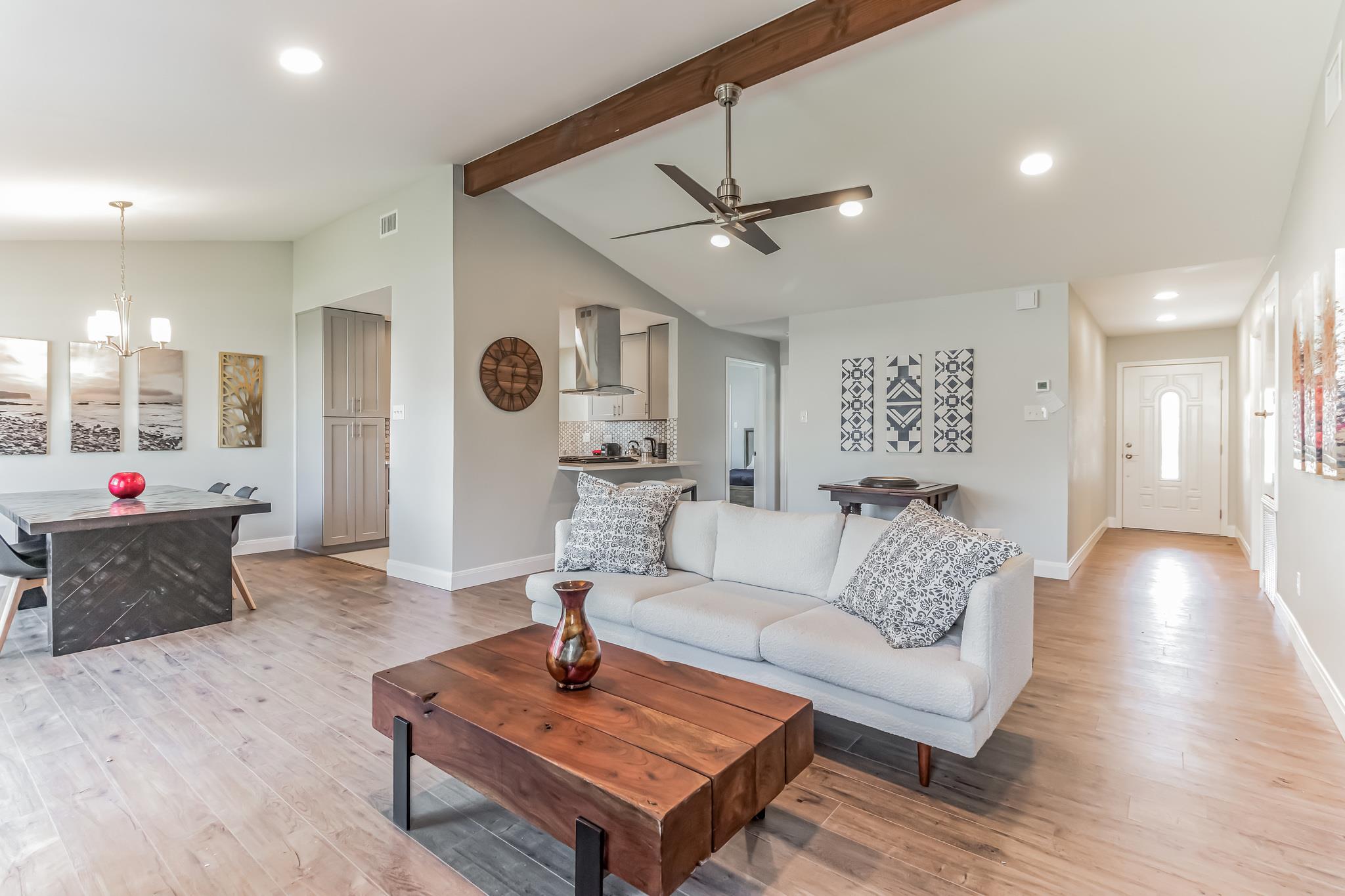 An open floorplan design highlights vaulted ceili
