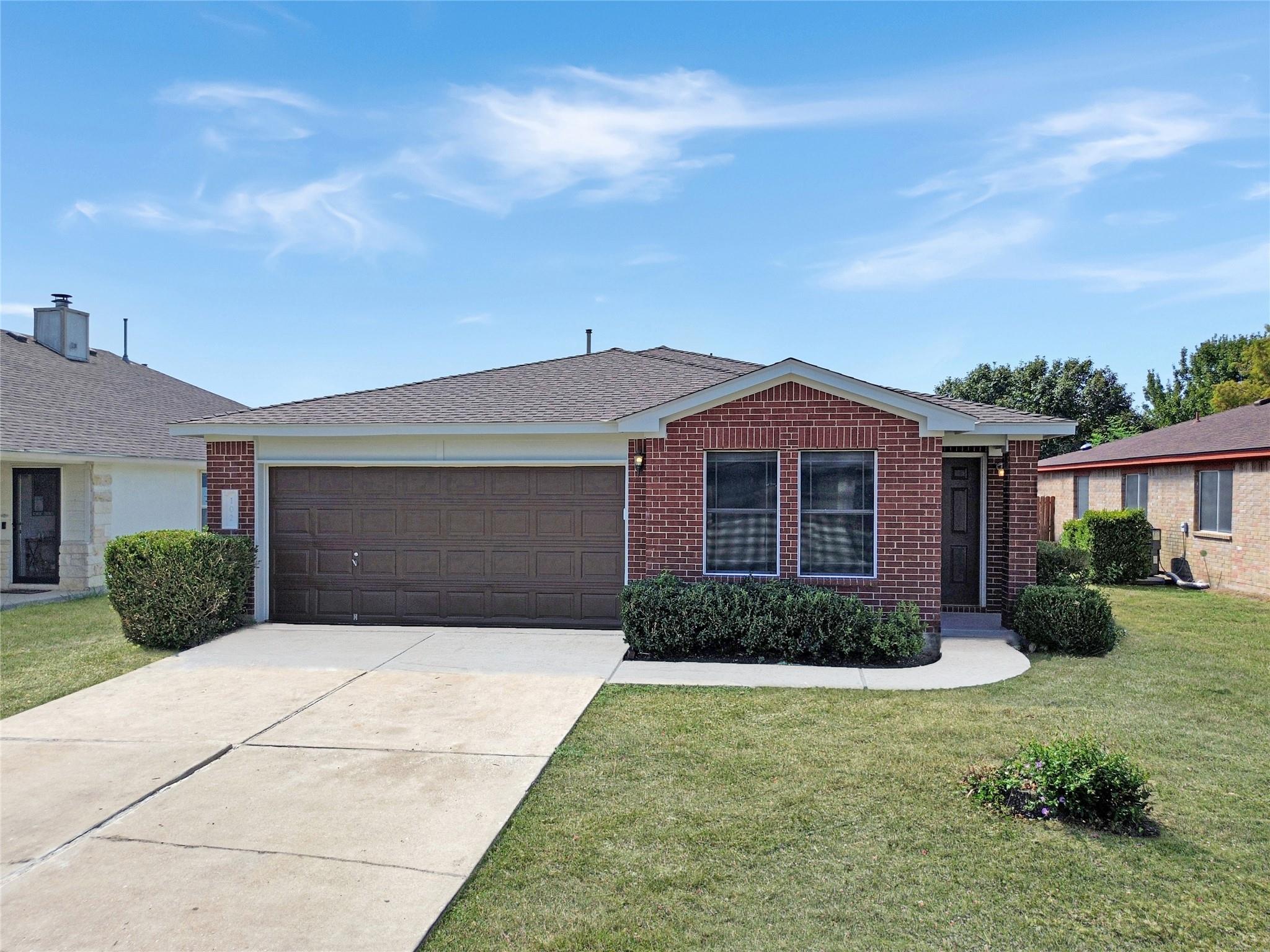 Classic brick exterior accents this single-story 