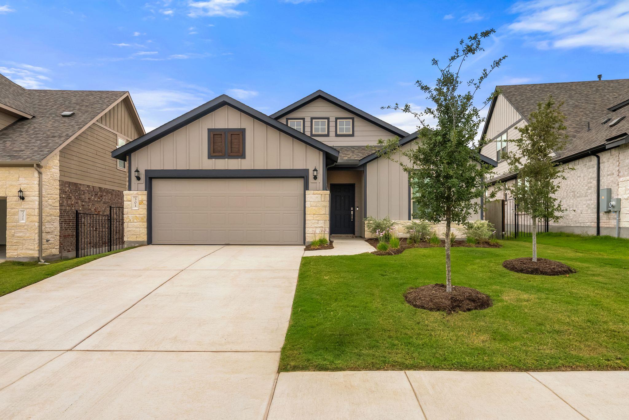Board and batten siding pairs with stone accents 
