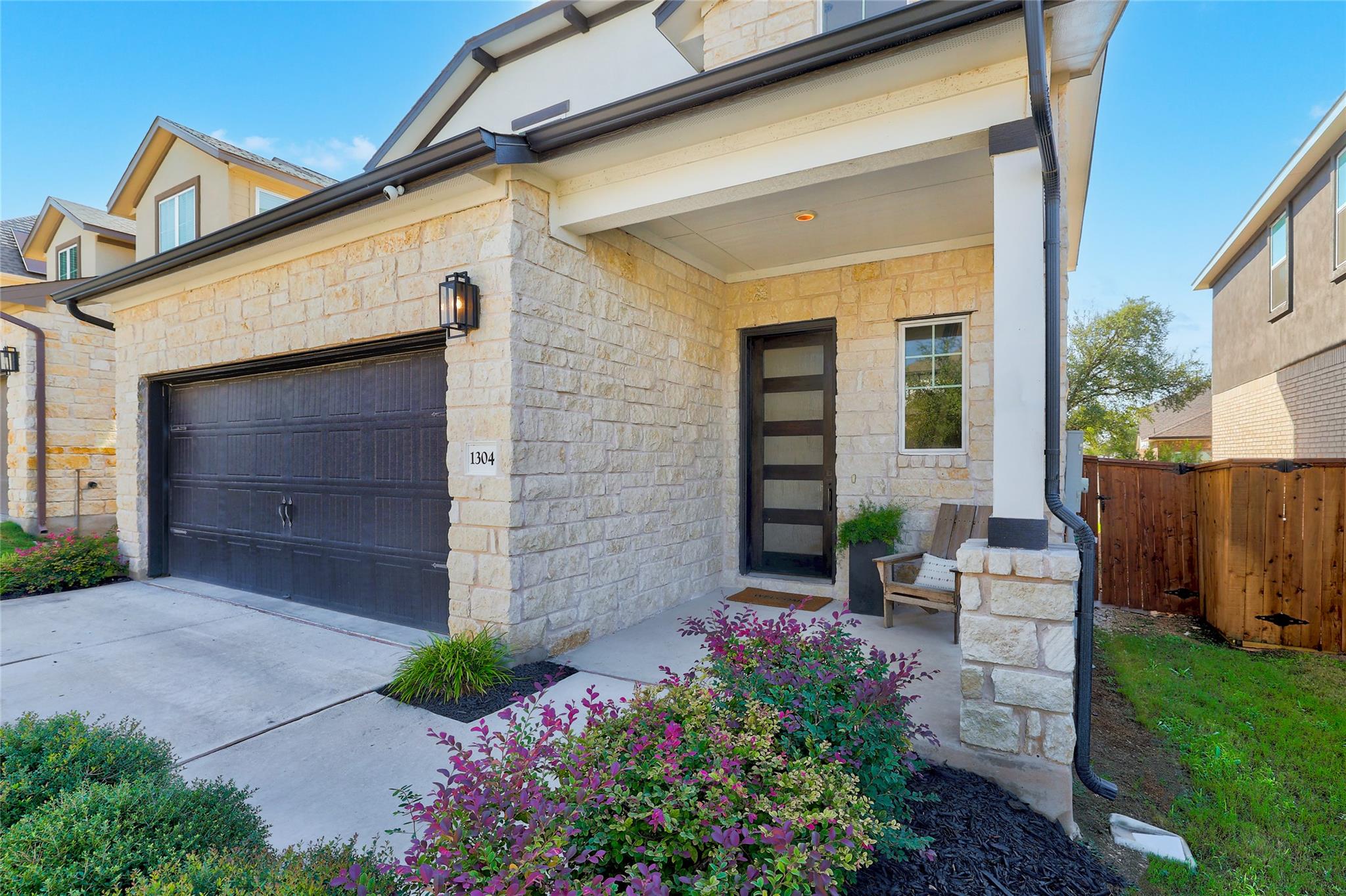A welcoming front porch with stone details and a 