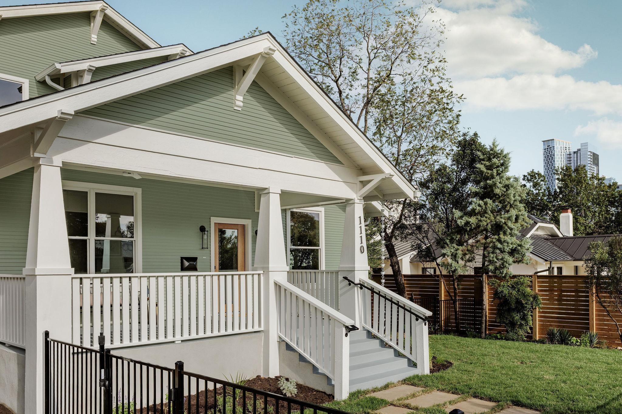 A welcoming front porch with classic wooden raili