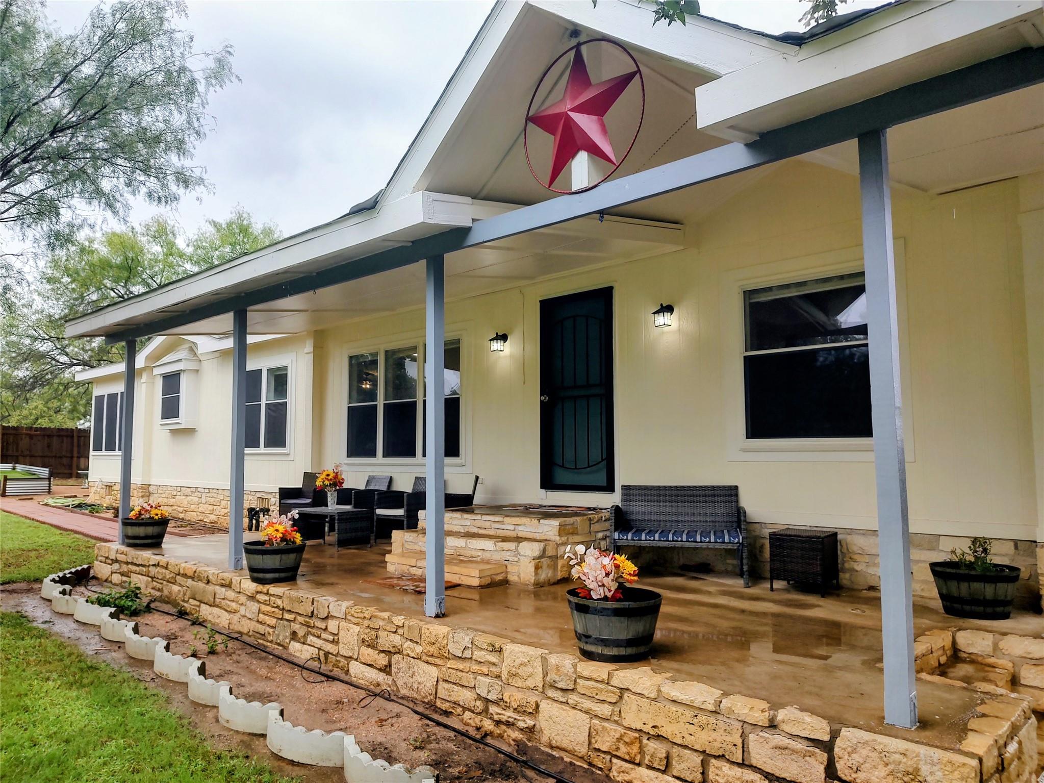 A welcoming front porch runs the length of this c