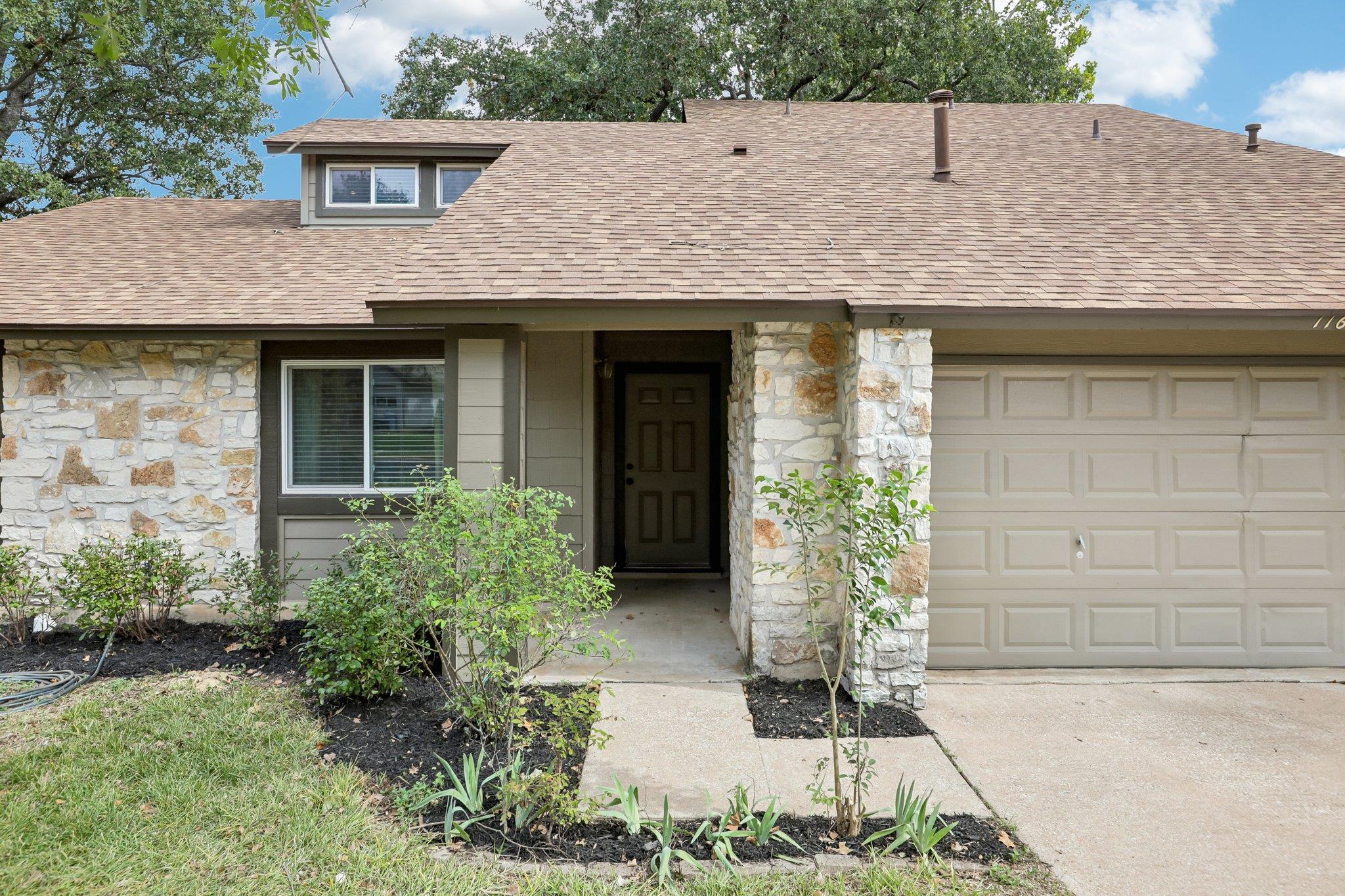 Natural stone accents and classic shingle details