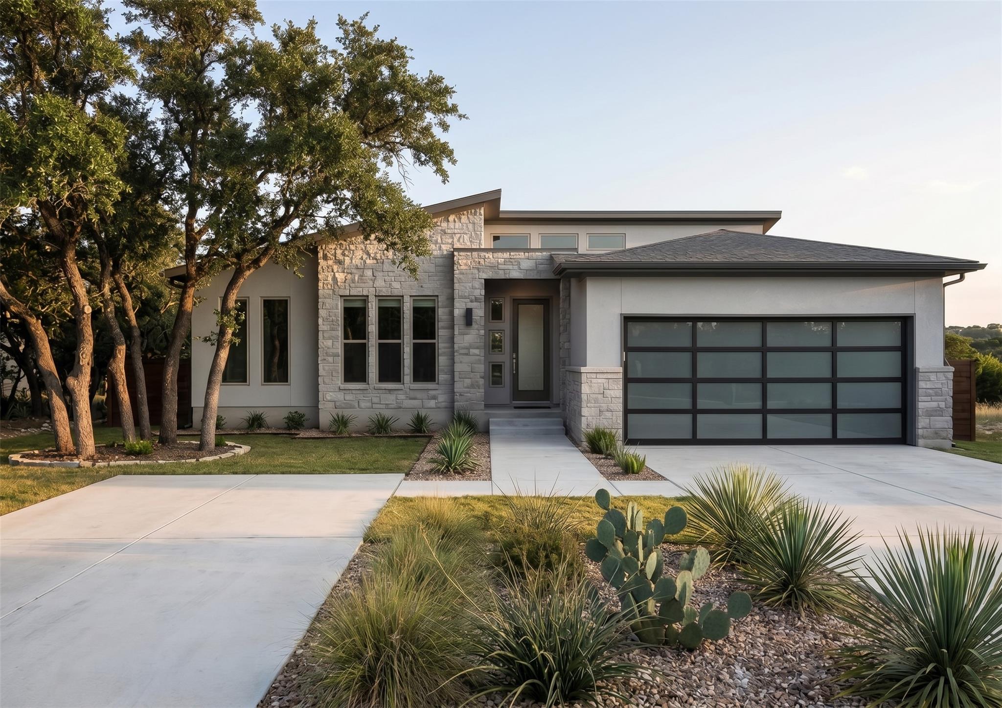 A modern stone and stucco exterior sits behind be