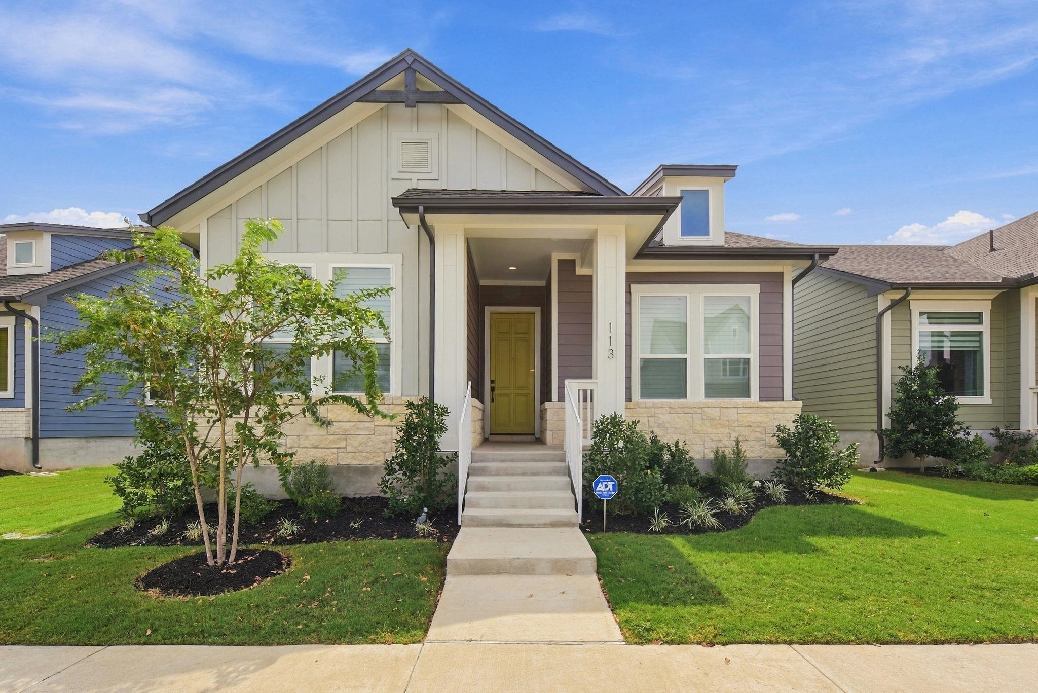 A welcoming front porch and crisp board-and-batte