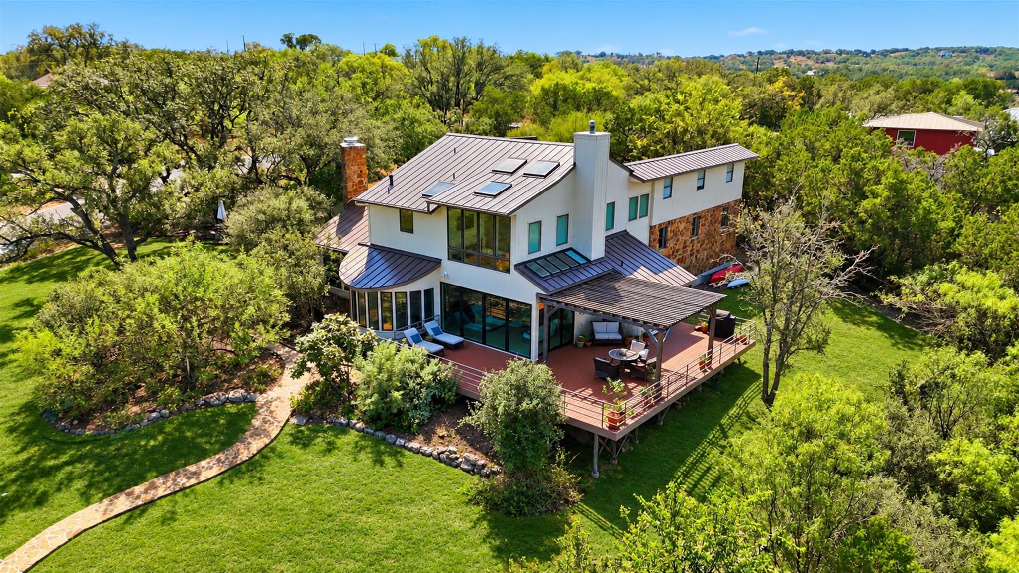 Mature trees surround this contemporary multi-lev