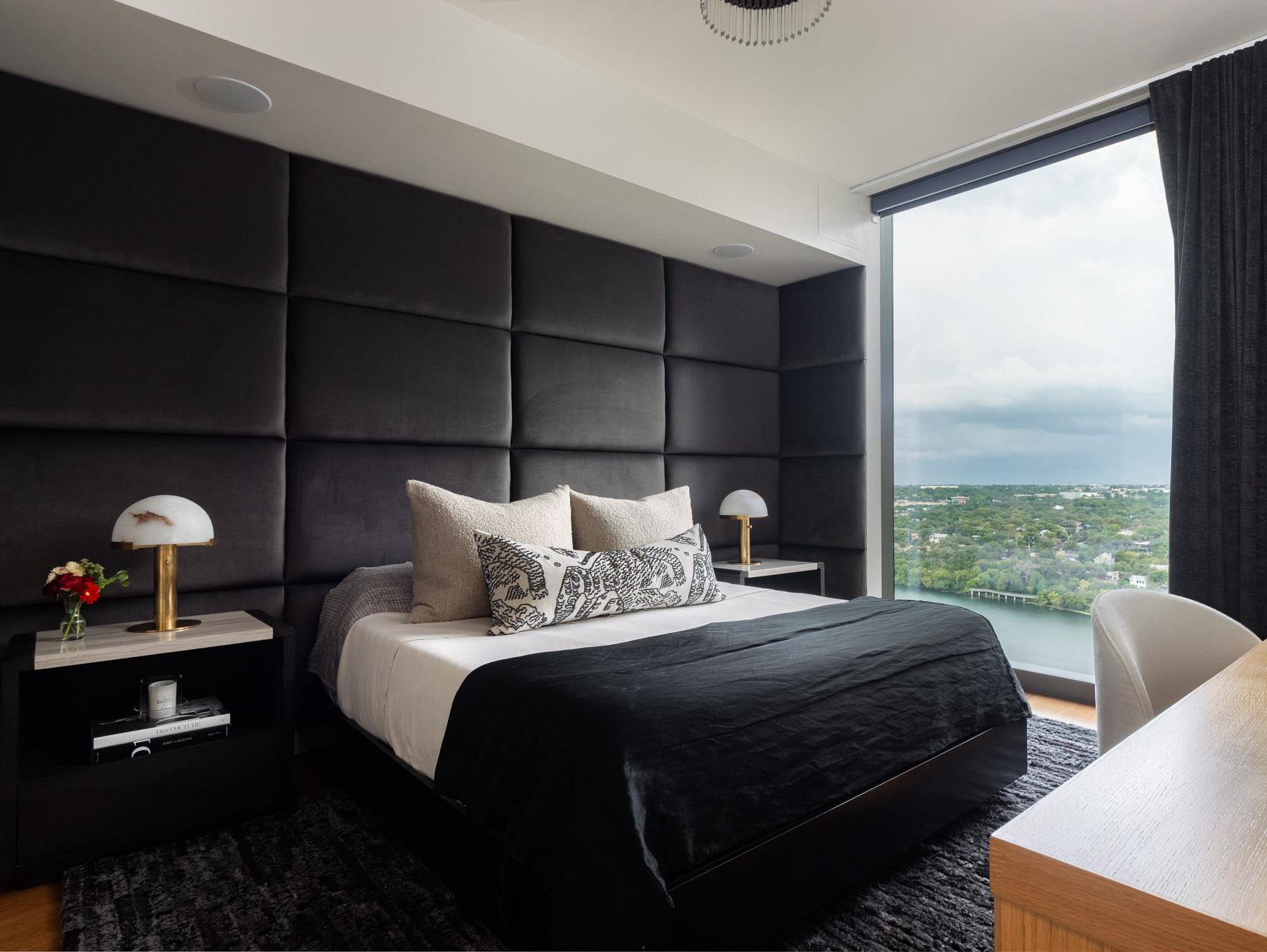 Floor-to-ceiling windows frame elevated water and