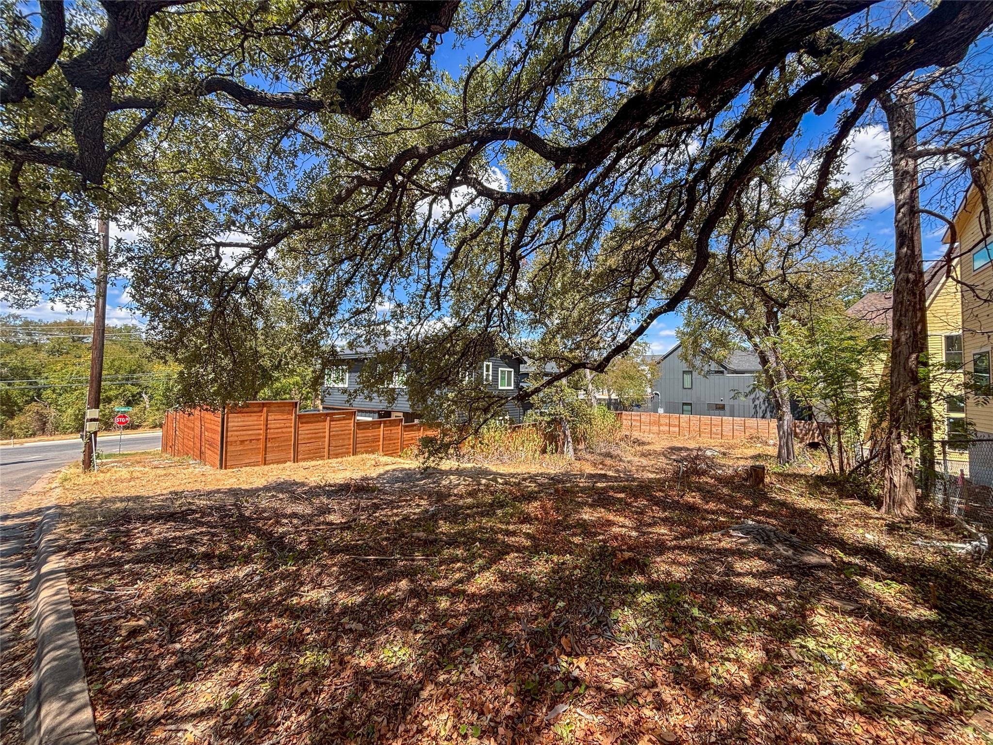 Mature trees shade this prime buildable lot set w