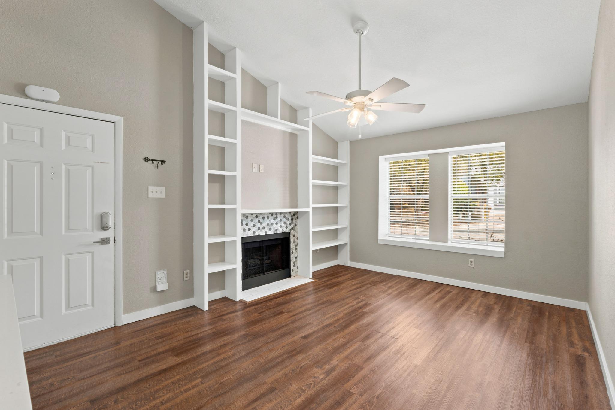 Gleaming hardwood floors and a customized firepla