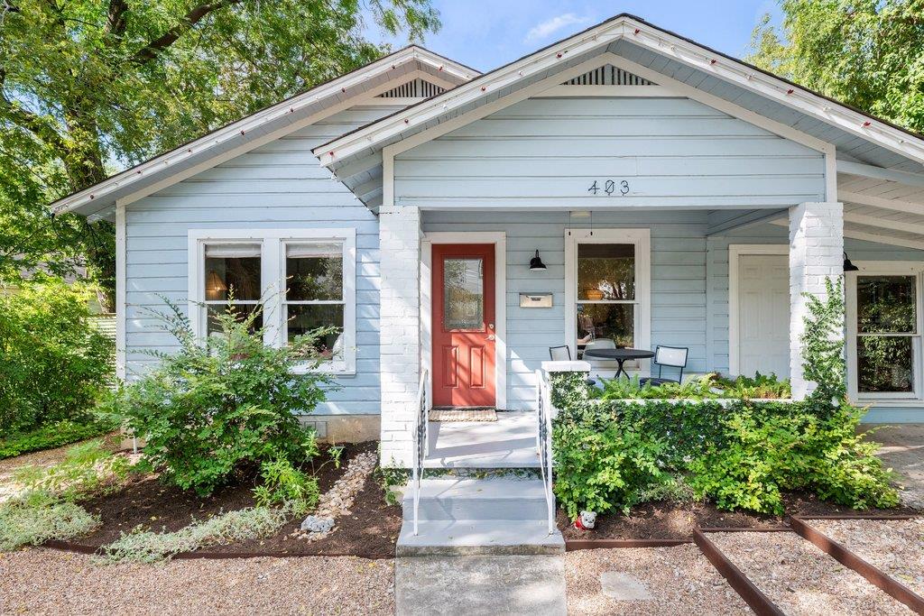 A welcoming front porch with classic siding and a