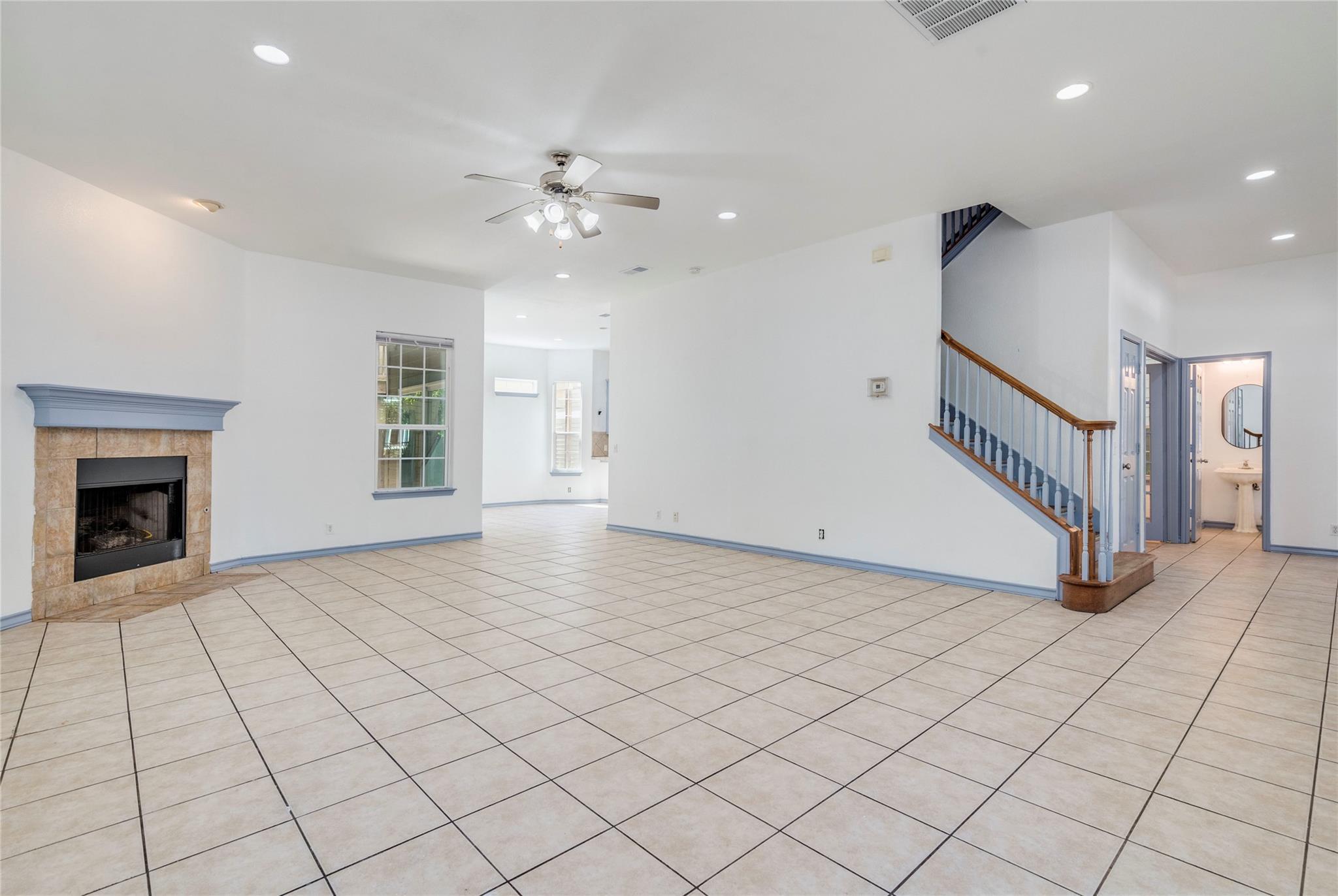 Clean tile floors complement a modern fireplace i